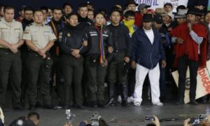 Eight uniformed officers were brought onto a stage and forced to address a crowd of thousands of activists but were not harmed